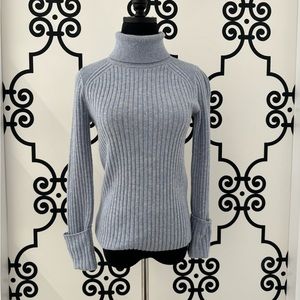 Light blue turtleneck Club Monaco sweater.